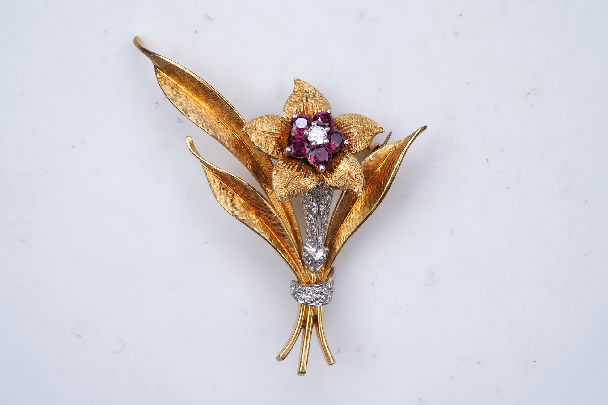 A gold, ruby and diamond brooch, circa 1966